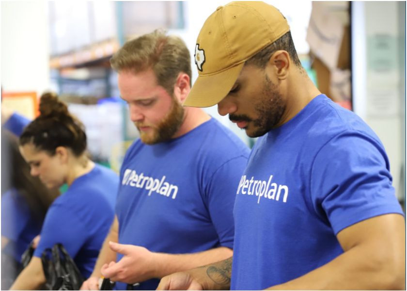 Petroplan team helping at the Houston Food Bank